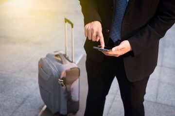 business traveler with suitcase