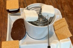 S'mores with chocolate, marshmallows, graham crackers, burner and marshmallow holder